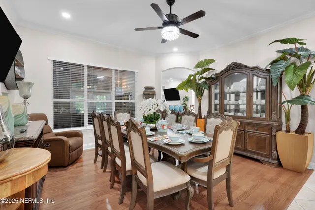a room with a potted plant on the table and a potted plant
