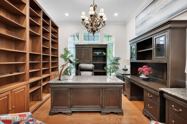 a kitchen with lots of counter space windows and a sink