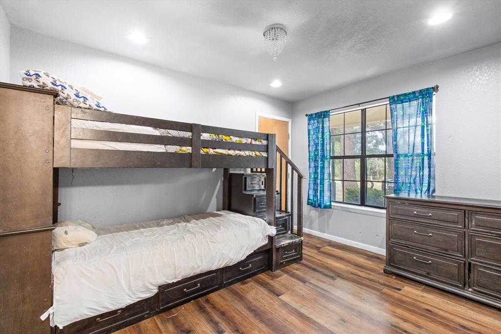 15870 County Road 339 Terrell, TX 75161 - Photo 17 of 26 a bedroom with a large bed and a window