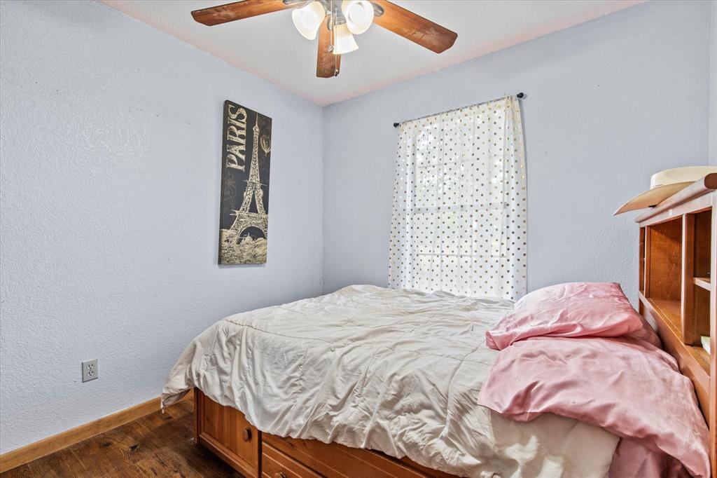15870 County Road 339 Terrell, TX 75161 - Photo 20 of 26 a bedroom with a bed and a window