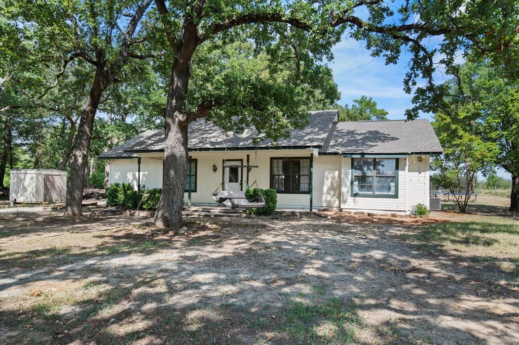 15870 County Road 339 Terrell, TX 75161 - Photo 2 of 26 a front view of a house with sitting area and garden