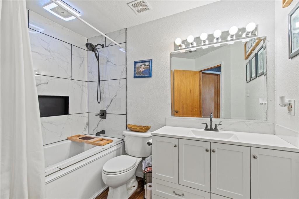 15870 County Road 339 Terrell, TX 75161 - Photo 21 of 26 a bathroom with a sink a toilet and a mirror