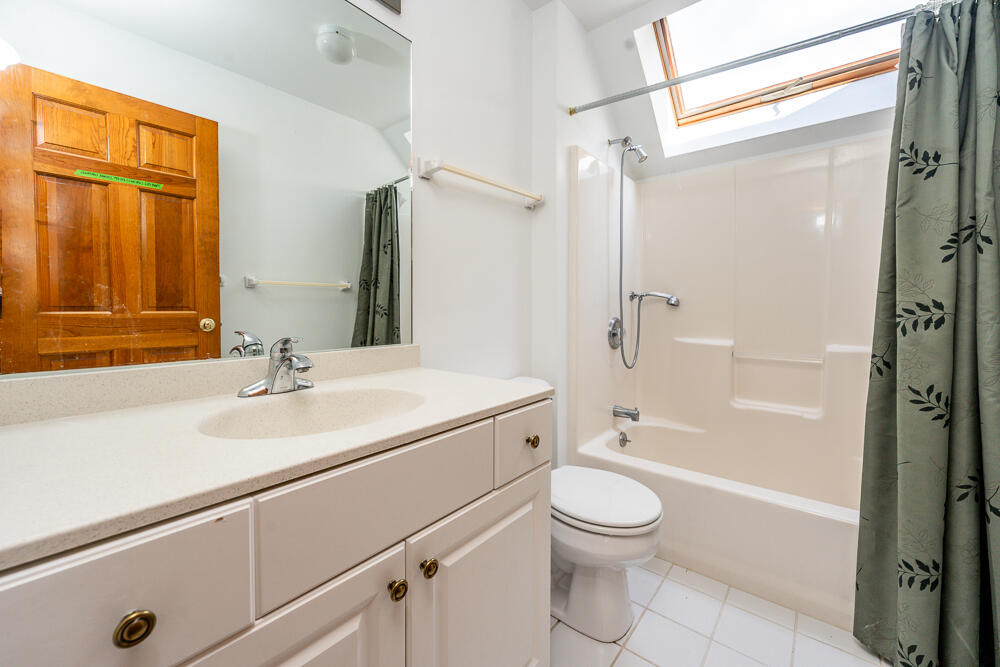 34 Ridgewood Road Orleans, MA 02653 - Photo 33 of 41 a bathroom with a granite countertop sink toilet a shower and a mirror