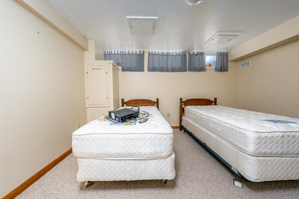 34 Ridgewood Road Orleans, MA 02653 - Photo 34 of 41 a bedroom with bed and a window