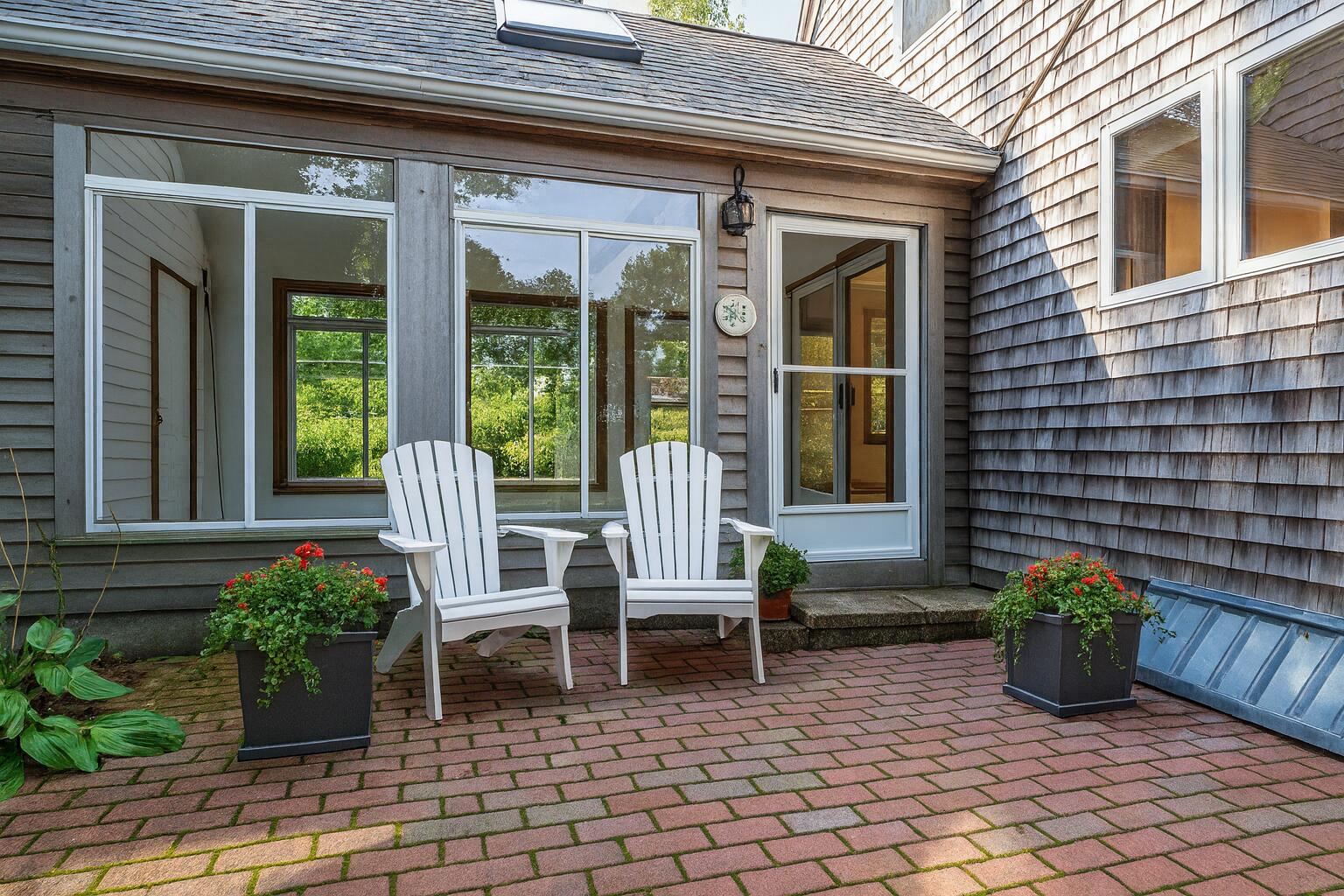 34 Ridgewood Road Orleans, MA 02653 - Photo 5 of 41 a view of a chair and table in the patio