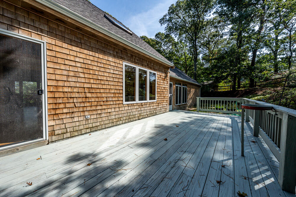 34 Ridgewood Road Orleans, MA 02653 - Photo 7 of 41 a view of backyard with deck and wooden floor