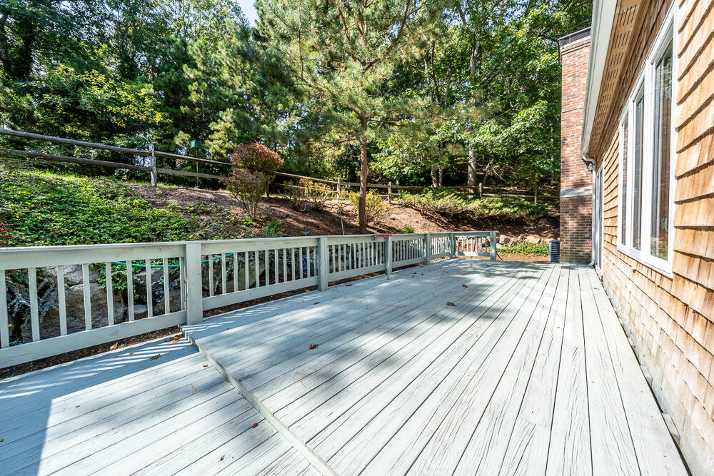 34 Ridgewood Road Orleans, MA 02653 - Photo 8 of 41 a view of backyard with deck and wooden floor