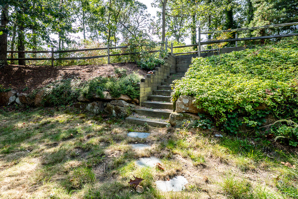 34 Ridgewood Road Orleans, MA 02653 - Photo 9 of 41 a backyard of a house with lots of green space