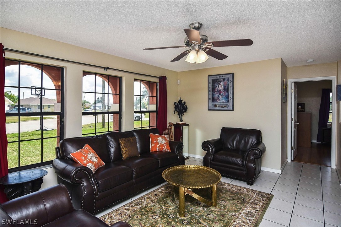 230 Danby Road Lehigh Acres, FL 33936 - Photo 8 of 35 a living room with furniture and a window