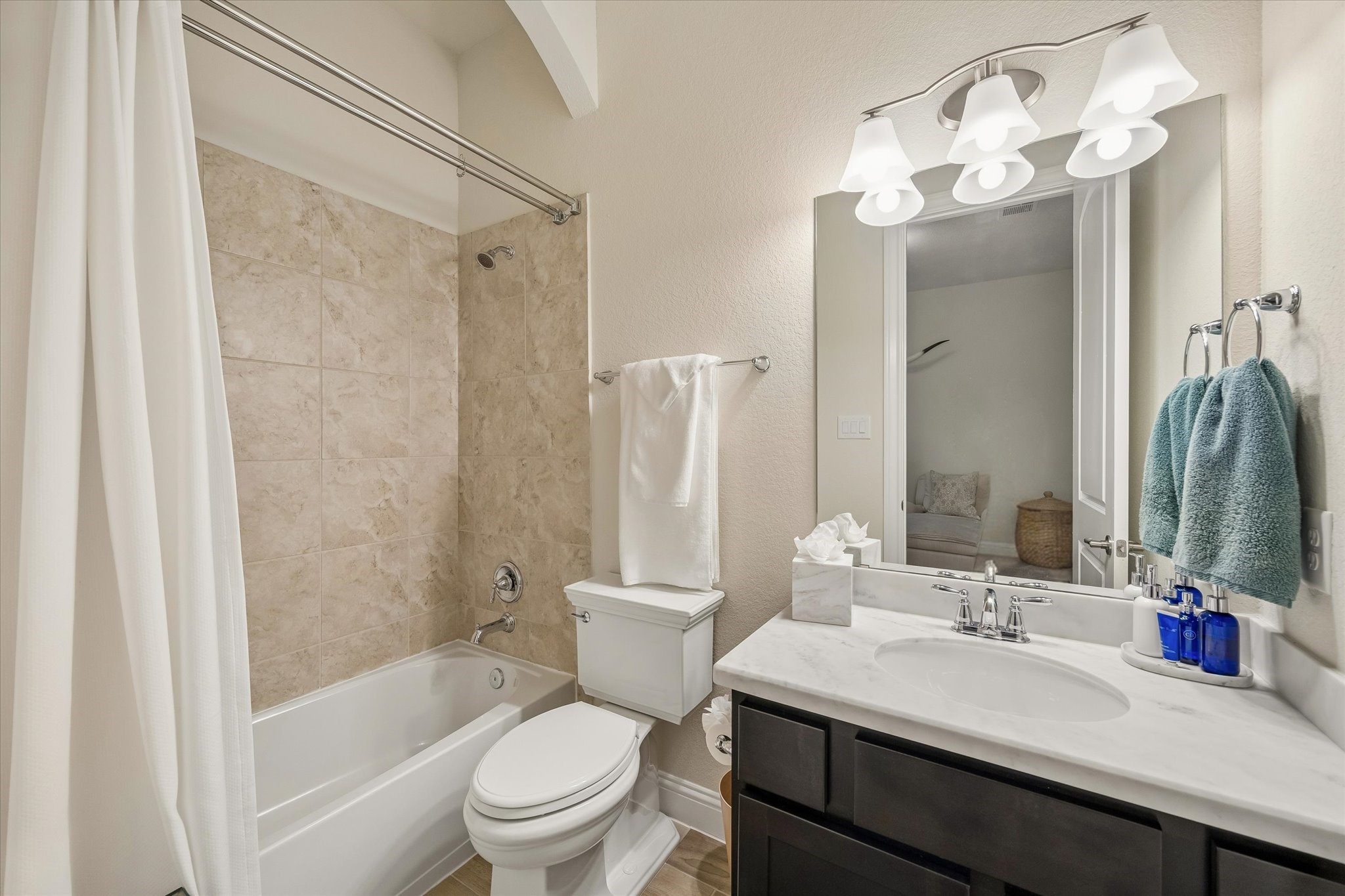 7418 Kearney Hill Lane Spring, TX 77389 - Photo 19 of 35 The secondary en-suite bathroom features a tub/shower combo! All baths feature Kohler toilets.