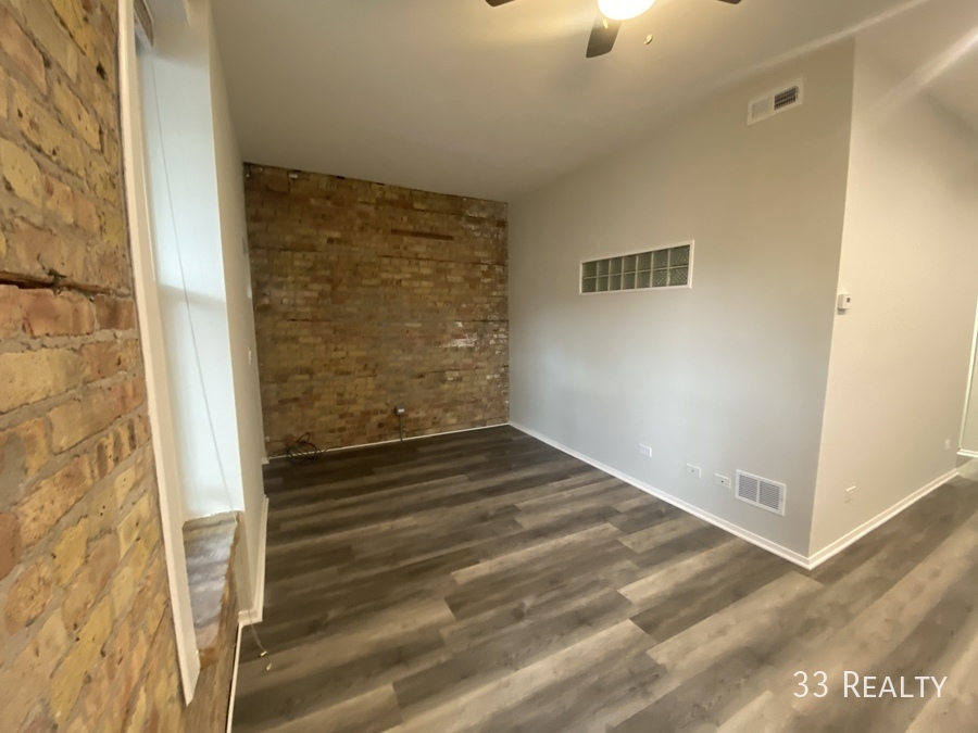 1246 North Cleaver Street, Unit GR Chicago, IL 60642 - Photo 3 of 7 a view of wooden door