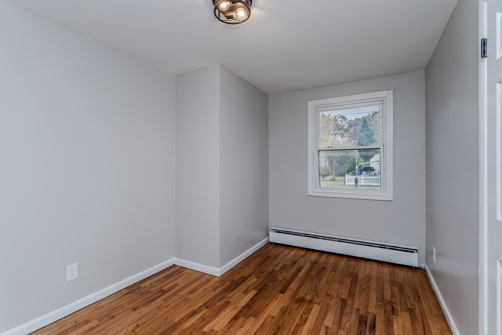 33 Grimard Street Ludlow, MA 01056 - Photo 16 of 27 a view of a room with wooden floor and window