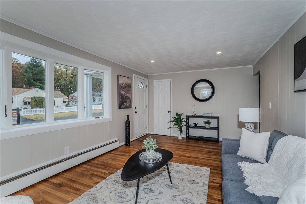33 Grimard Street Ludlow, MA 01056 - Photo 7 of 27 a living room with furniture and a large window