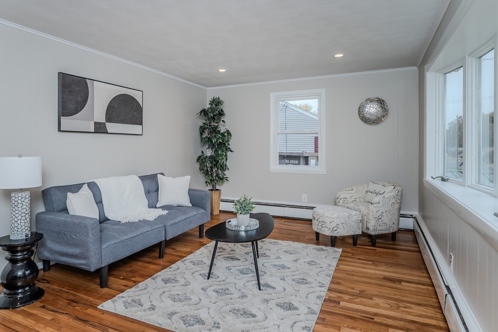 33 Grimard Street Ludlow, MA 01056 - Photo 8 of 27 a living room with furniture and a rug