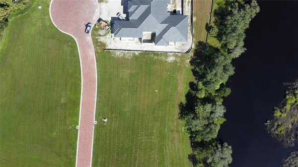 an aerial view of a house with a garden