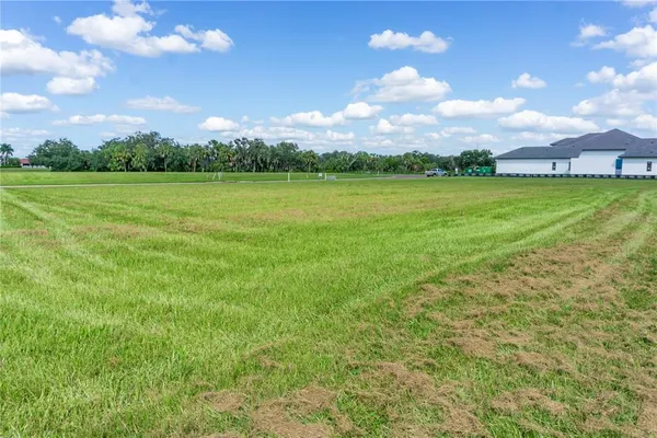 a view of a lake with a big yard