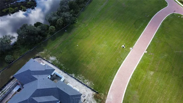a view of a lake with a yard