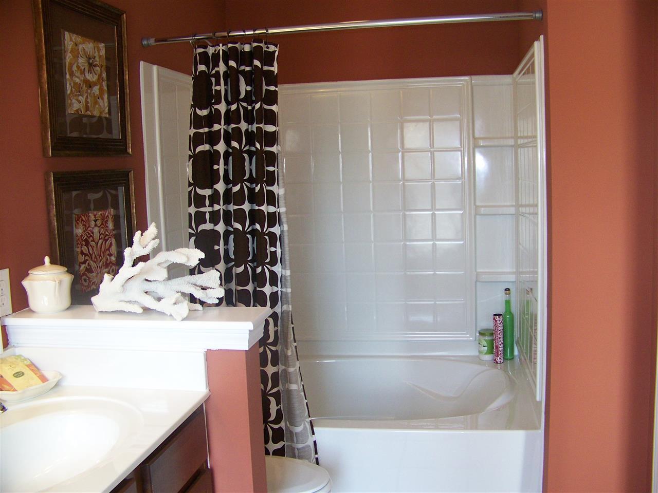 5301 Stowecroft Lane Raleigh, NC 27616 - Photo 12 of 25 a bathroom with a bathtub and a sink