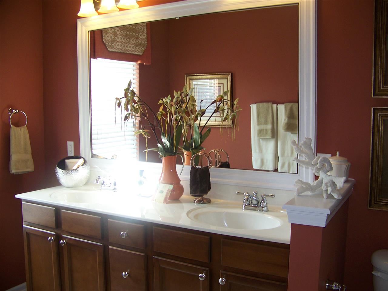 5301 Stowecroft Lane Raleigh, NC 27616 - Photo 13 of 25 a bathroom with a sink and a mirror