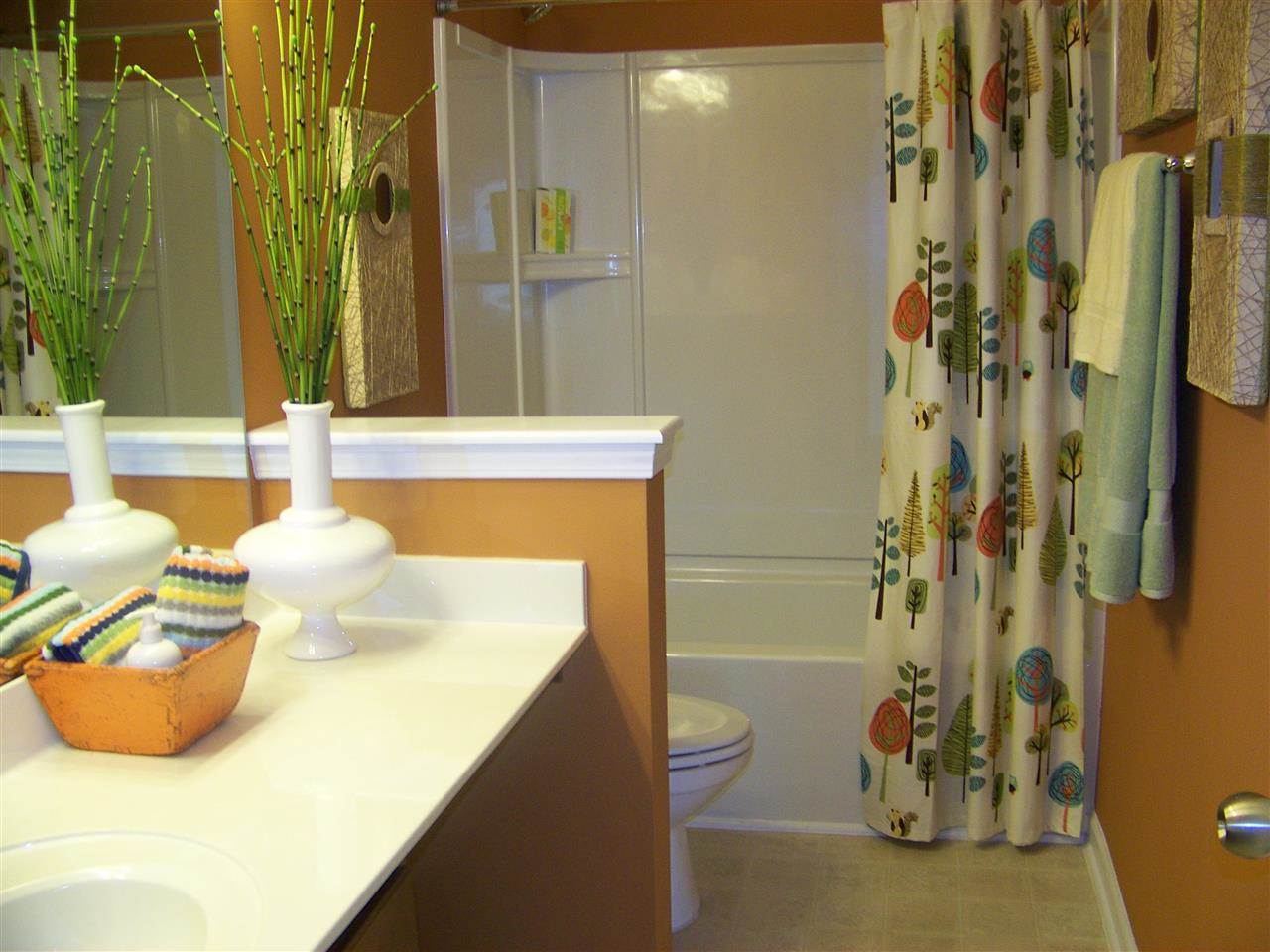 5301 Stowecroft Lane Raleigh, NC 27616 - Photo 17 of 25 a bathroom with a sink and a mirror