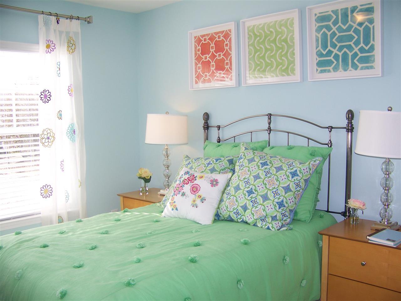 5301 Stowecroft Lane Raleigh, NC 27616 - Photo 18 of 25 a bedroom with a bed and a window