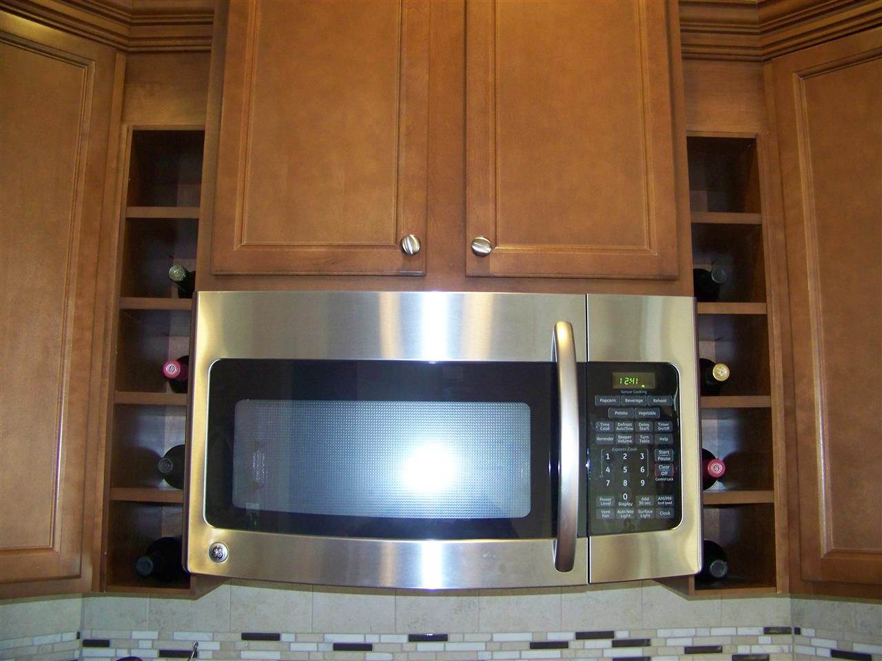 5301 Stowecroft Lane Raleigh, NC 27616 - Photo 9 of 25 a kitchen with stainless steel appliances wooden cabinets and a counter top space