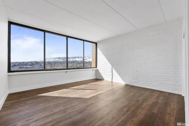 a view of a street with benches