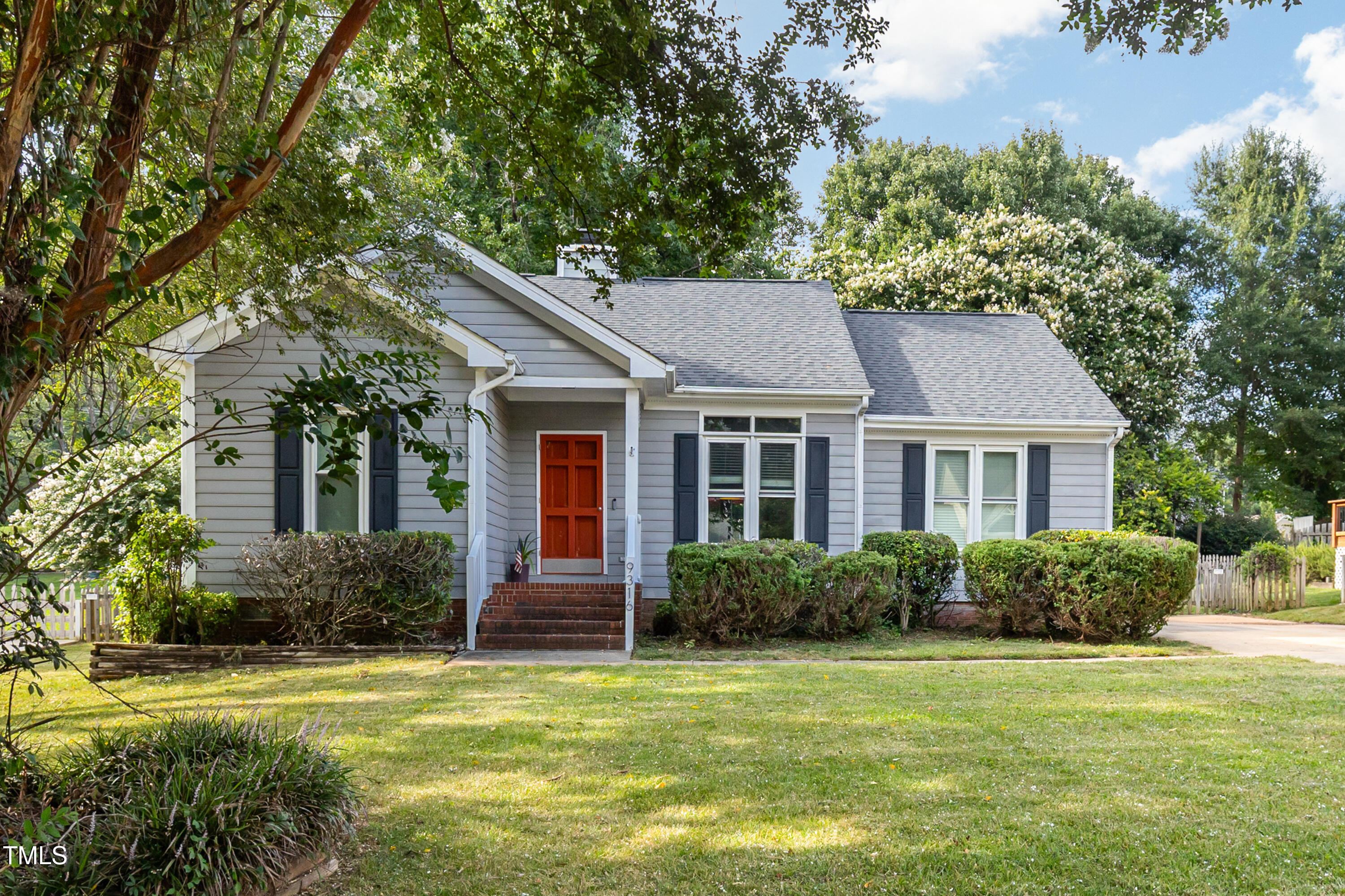 9316 Dawnshire Road Raleigh, NC 27615 - Photo 1 of 31 a view of a house with a garden