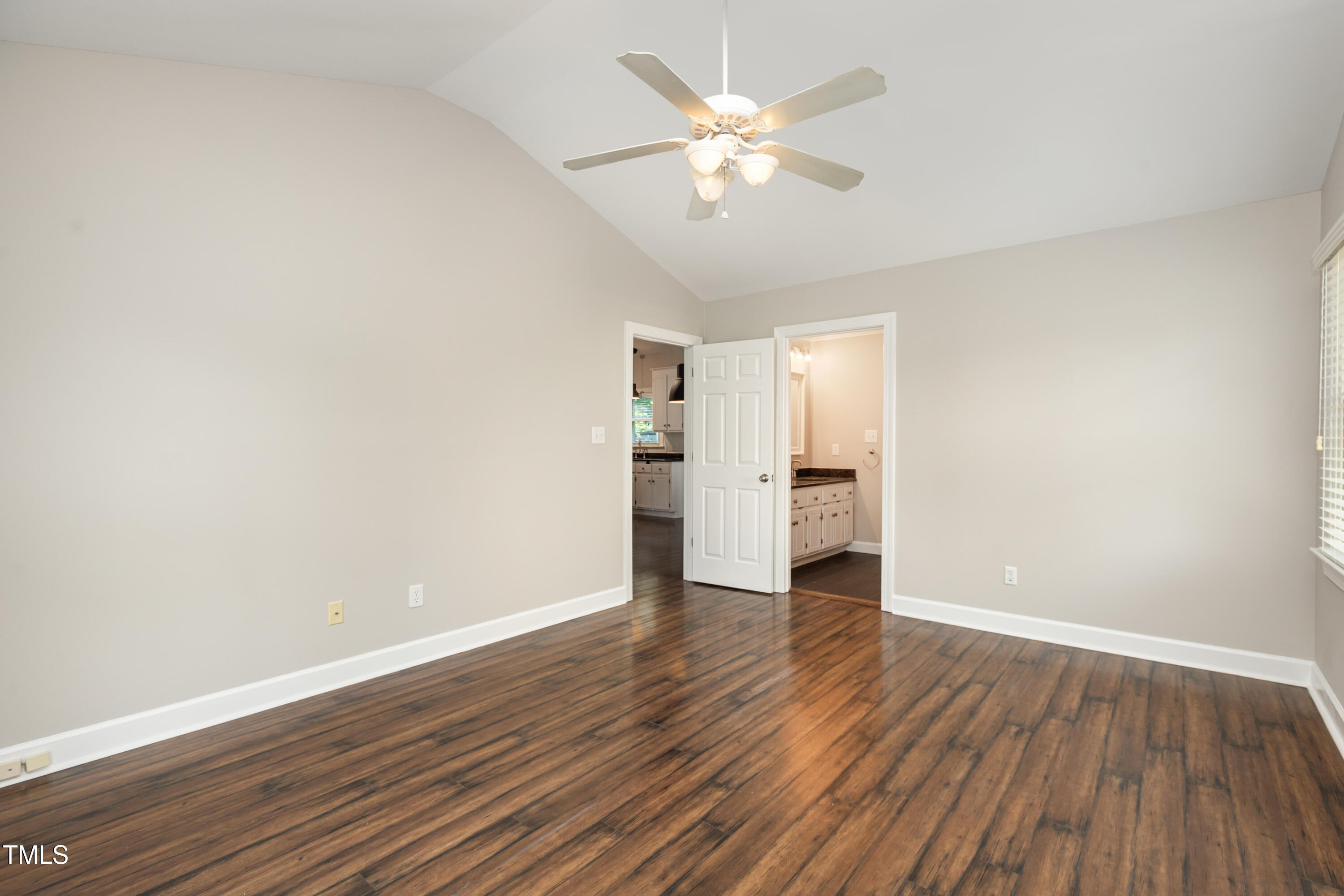 9316 Dawnshire Road Raleigh, NC 27615 - Photo 16 of 31 wooden floor in an empty room with a window