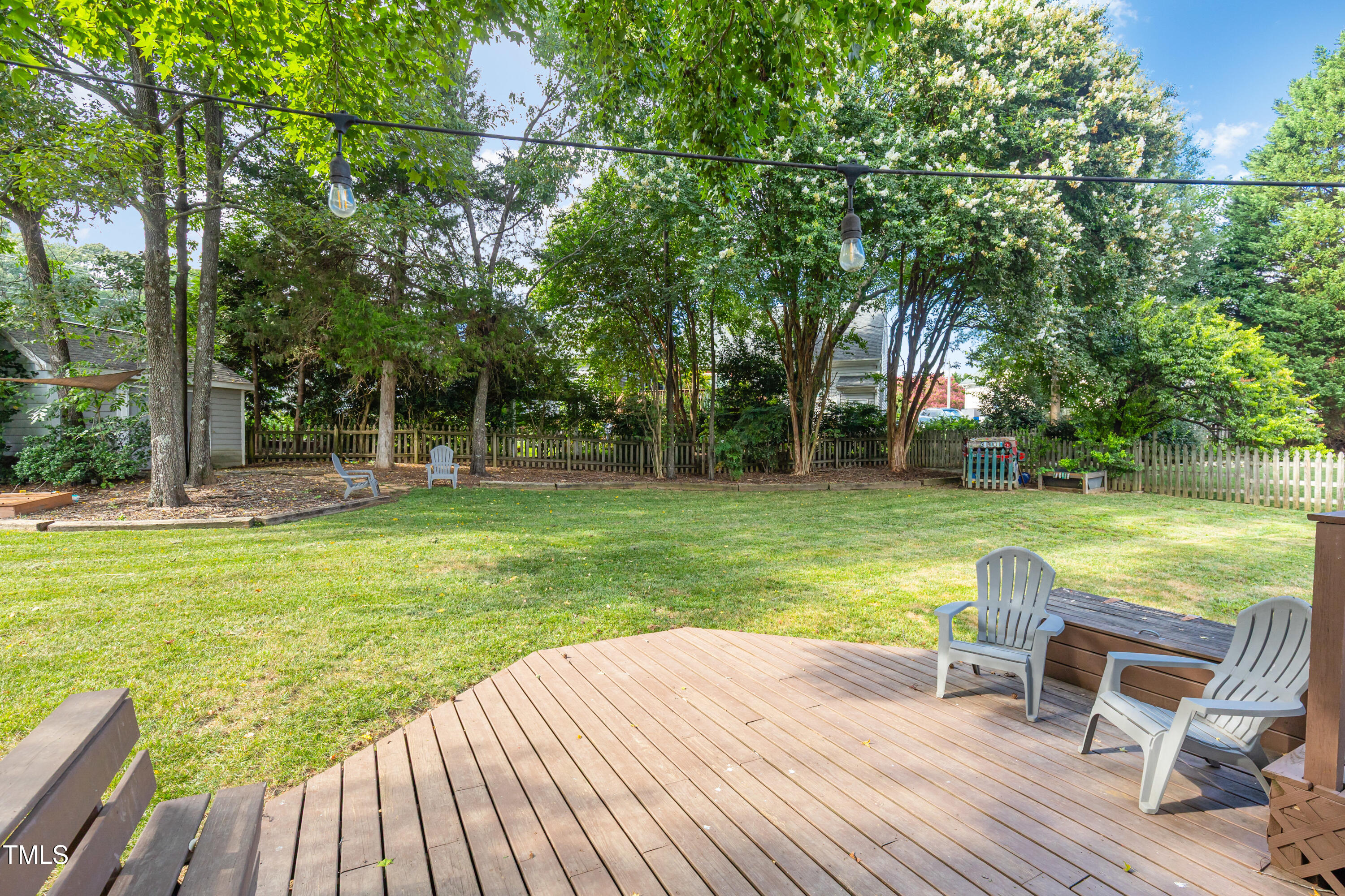 9316 Dawnshire Road Raleigh, NC 27615 - Photo 6 of 31 a view of a swimming pool with a patio