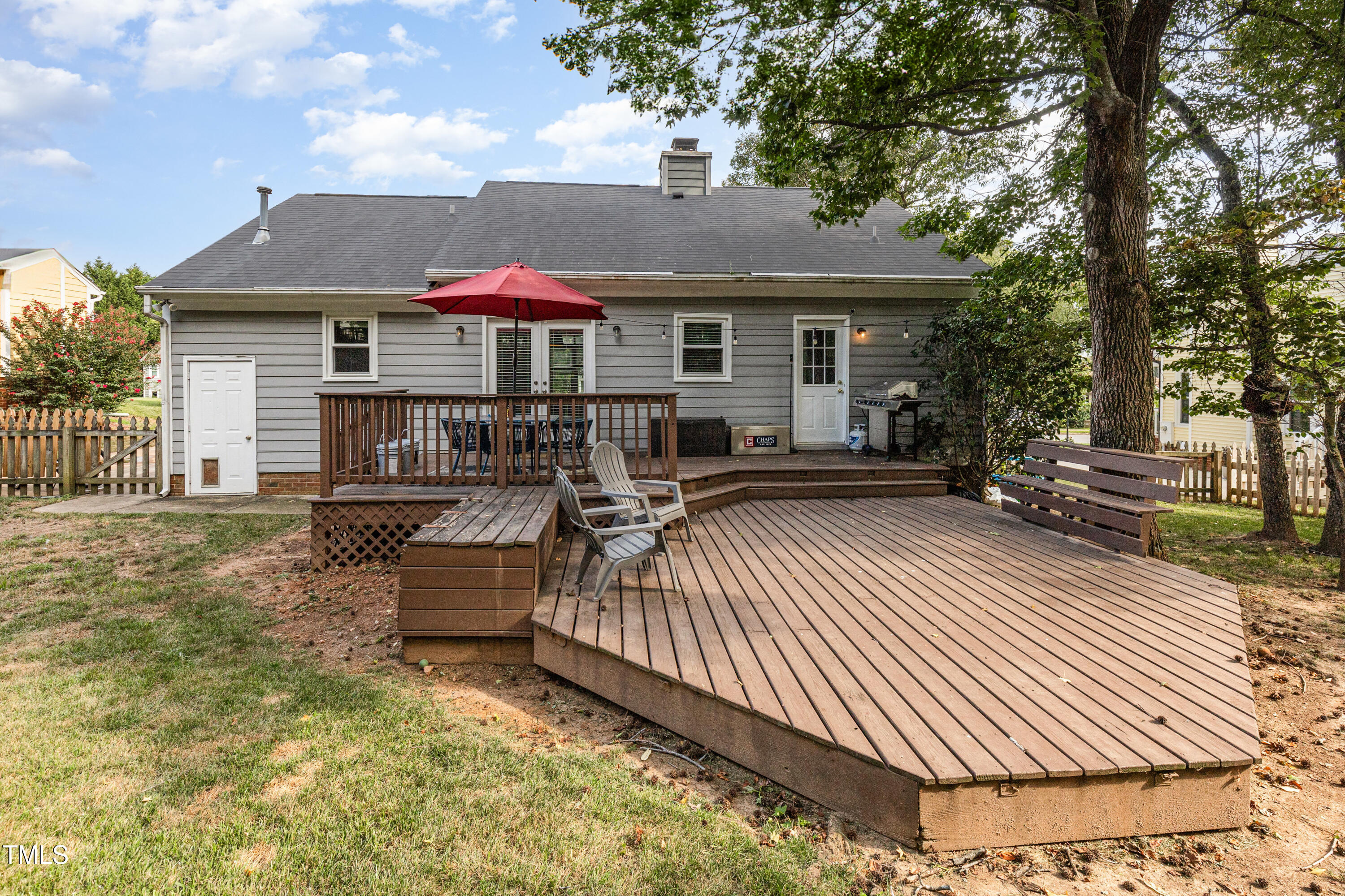 9316 Dawnshire Road Raleigh, NC 27615 - Photo 7 of 31 a view of a house with backyard and sitting area