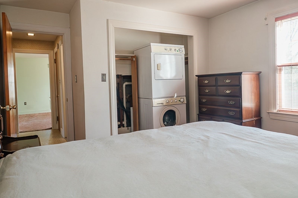 7 Park Street Hamilton, MA 01982 - Photo 12 of 36 a bedroom with a bed and a dresser