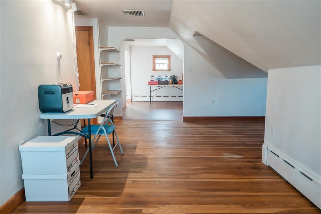 7 Park Street Hamilton, MA 01982 - Photo 15 of 36 a view of a hallway with furniture and wooden floor