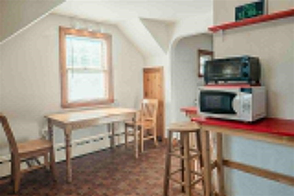 7 Park Street Hamilton, MA 01982 - Photo 16 of 36 a living room with furniture and a flat screen tv