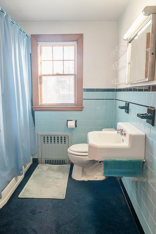 7 Park Street Hamilton, MA 01982 - Photo 27 of 36 a bathroom with a sink a toilet and window