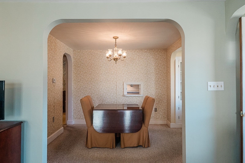 7 Park Street Hamilton, MA 01982 - Photo 3 of 36 a view of a dining room with furniture and chandelier