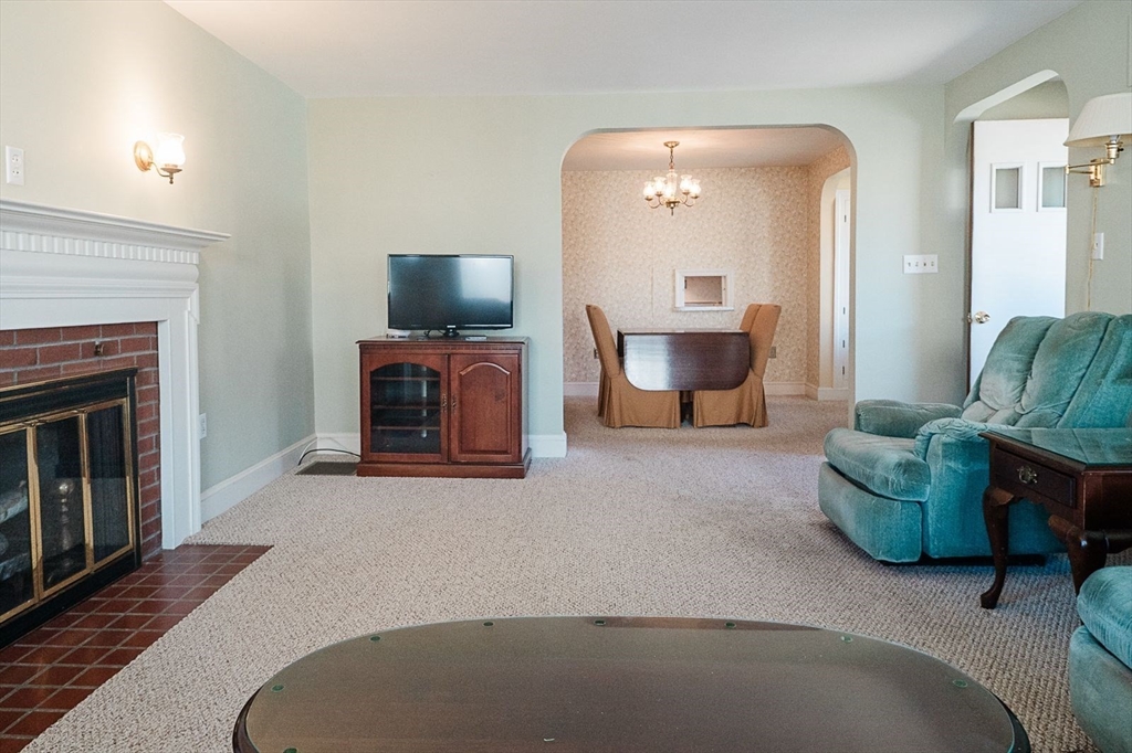 7 Park Street Hamilton, MA 01982 - Photo 5 of 36 a living room with furniture and a fireplace