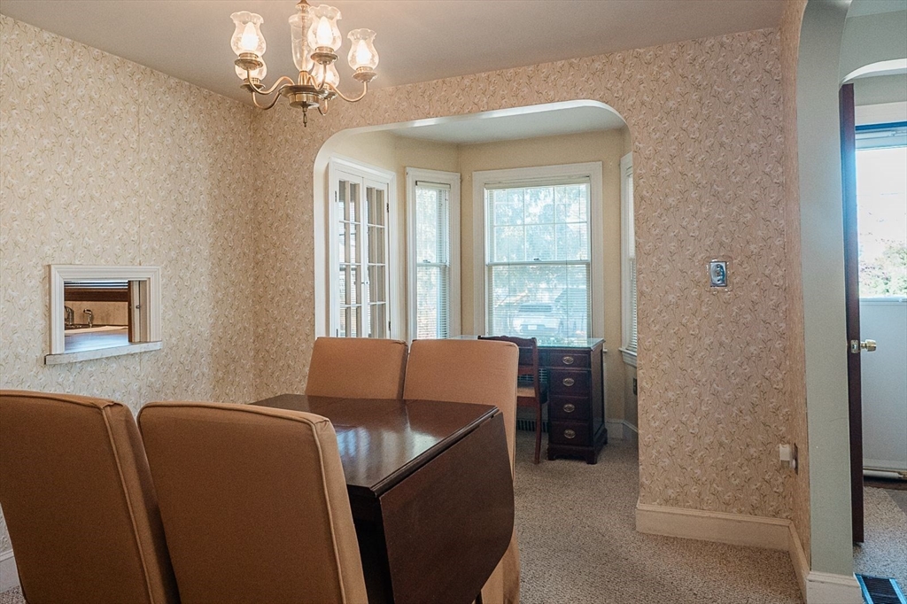 7 Park Street Hamilton, MA 01982 - Photo 7 of 36 a room that has a couch and a window