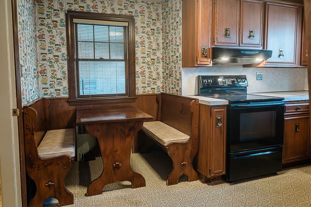 7 Park Street Hamilton, MA 01982 - Photo 8 of 36 a kitchen with stainless steel appliances granite countertop a stove and a microwave
