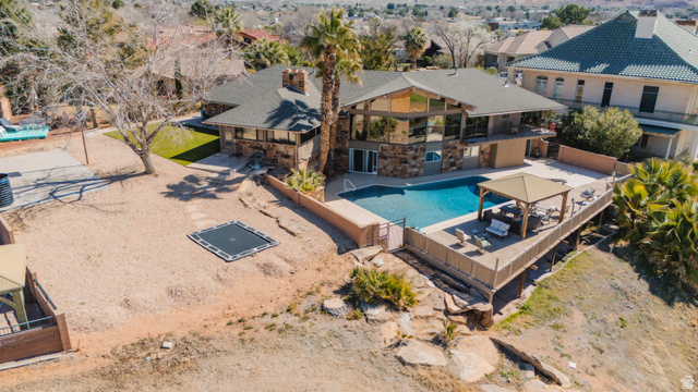 980 Cactus Circle St. George, UT 84790 - Photo 49 of 77 View of pool with a fenced backyard, area for grilling, and a wooden deck