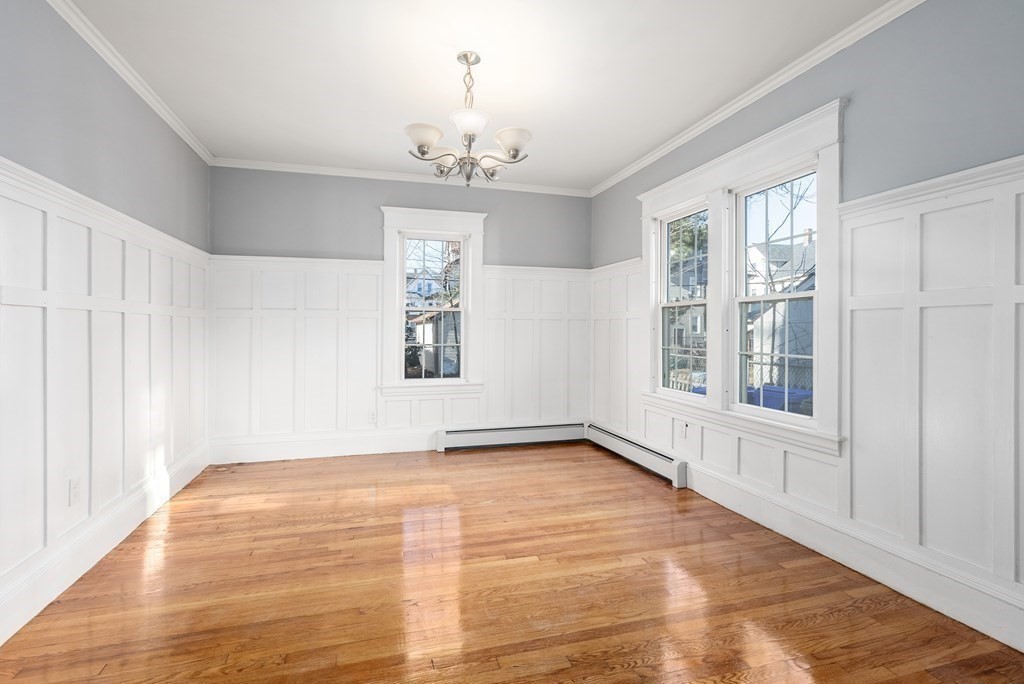 14 Burton Street Springfield, MA 01108 - Photo 16 of 35 a view of an empty room with a window and wooden floor