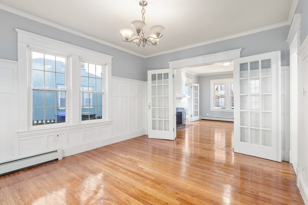 14 Burton Street Springfield, MA 01108 - Photo 17 of 35 a view of an empty room with wooden floor and windows