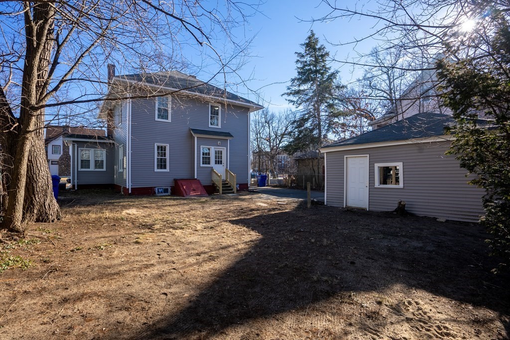 14 Burton Street Springfield, MA 01108 - Photo 6 of 35 a view of a house with a yard covered with snow