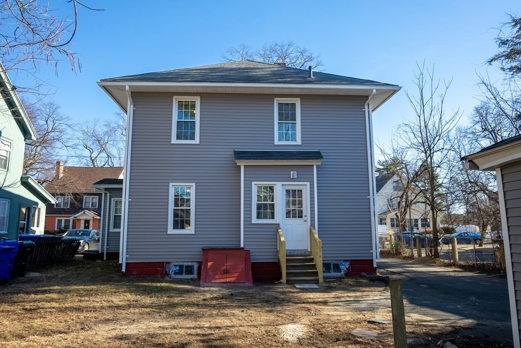 14 Burton Street Springfield, MA 01108 - Photo 8 of 35 a front view of a house with a yard