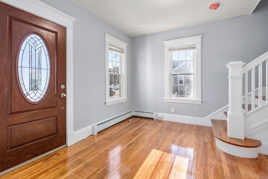 14 Burton Street Springfield, MA 01108 - Photo 9 of 35 an entryway with wooden floor cabinet and a rug
