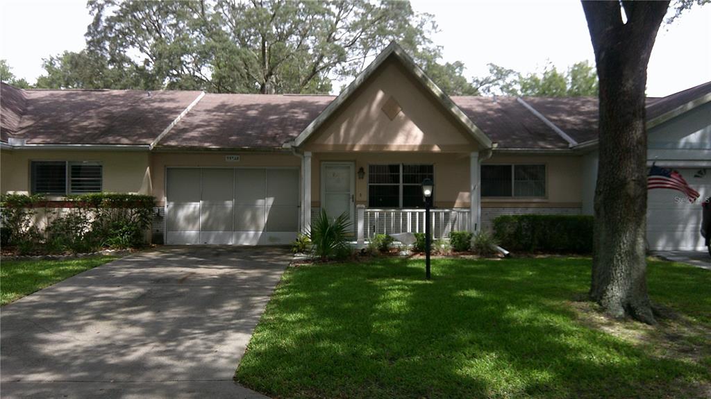 9652 Southwest 84th Terrace, Unit D Ocala, FL 34481 - Photo 1 of 1 a front view of a house with yard