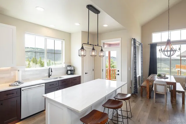 a very nice looking dining room with a large window