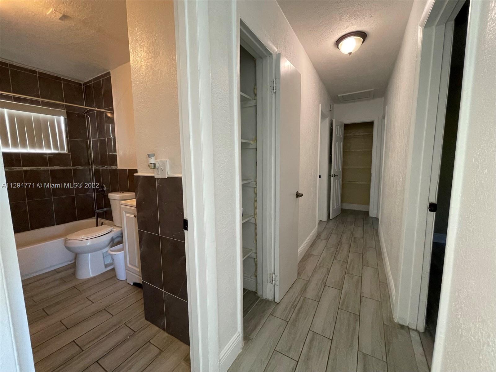 14515 Southwest 105th Court Miami, FL 33176 - Photo 13 of 30 a bathroom with a toilet and a shower