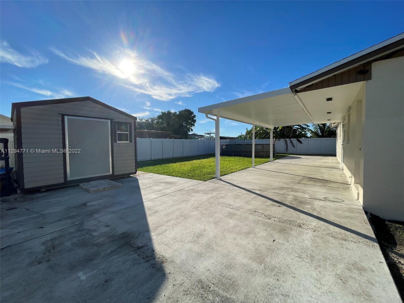 14515 Southwest 105th Court Miami, FL 33176 - Photo 21 of 30 a view of a backyard of the house