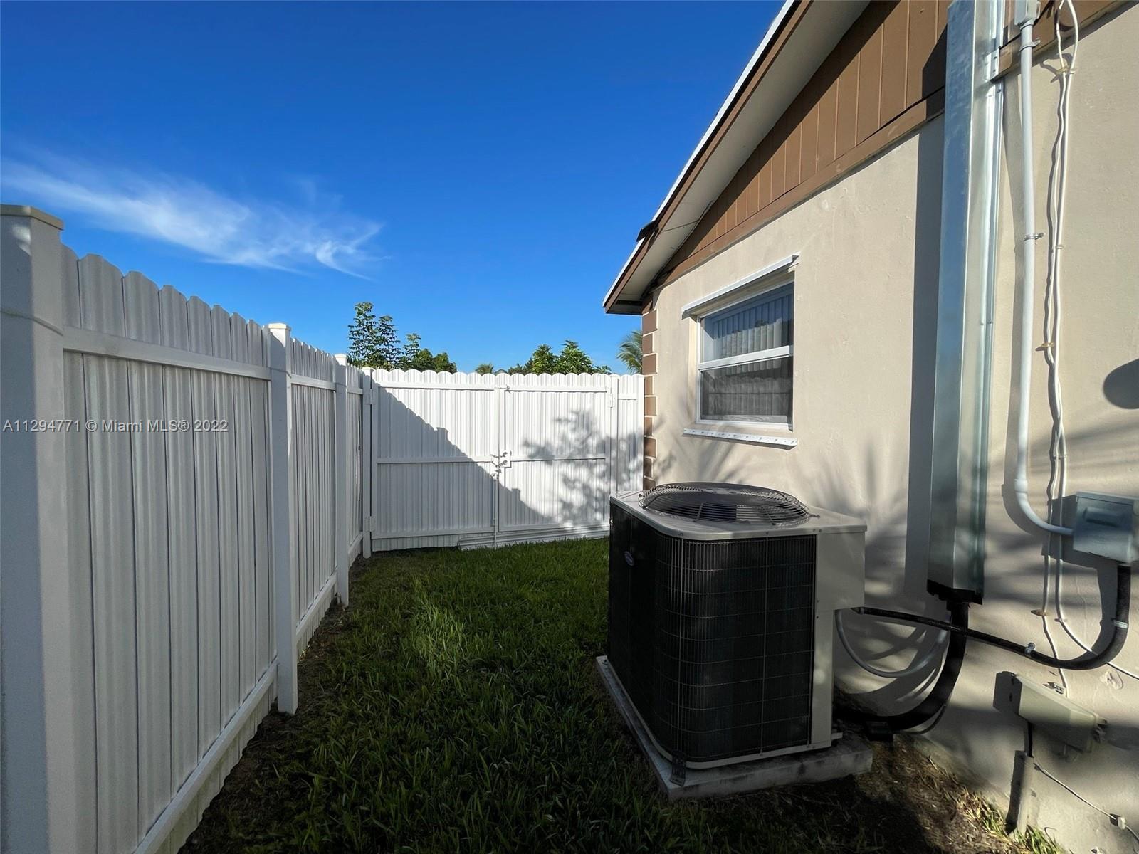 14515 Southwest 105th Court Miami, FL 33176 - Photo 28 of 30 a view of a small house with backyard